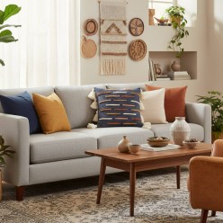 Cuscino geometrico in cotone con dettagli ricamati e texture a rilievo