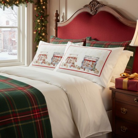 Federe Natalizie Boutique Eleganti su Letto Bianco con Decorazioni e Luci Festive